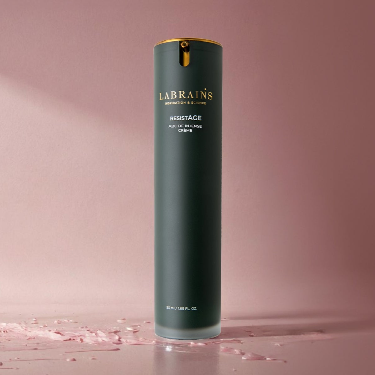 bottle of LABRAINS abc de intense creme on pink background