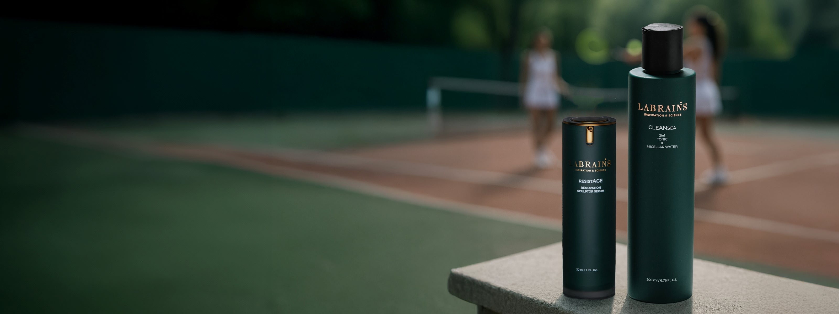 hero banner containing two labrains skincare products with blurred sports setting in the background