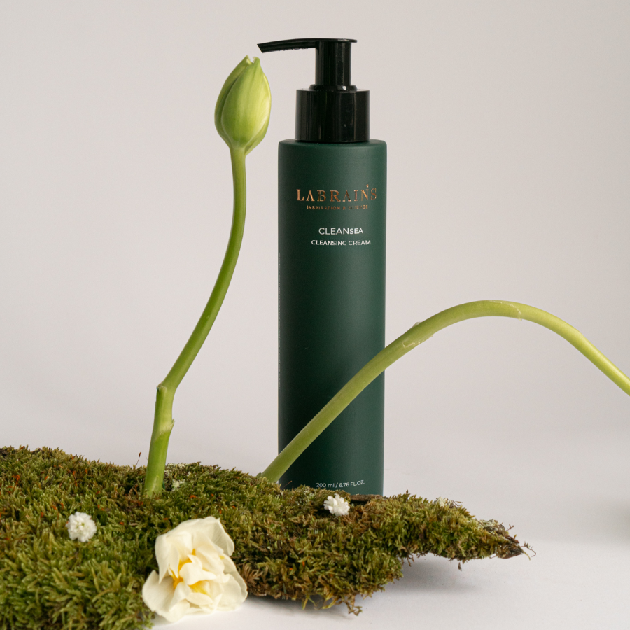 labrains cleansing cream on light background with a flower and moss