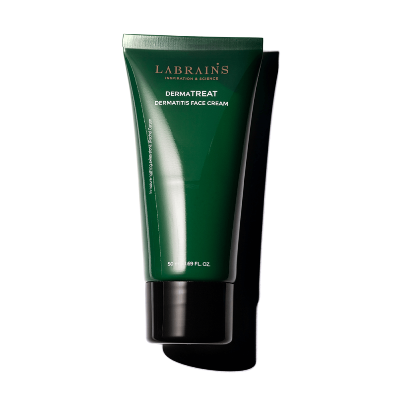 A green tube of LABRAINS DERMATREAT cream on white background