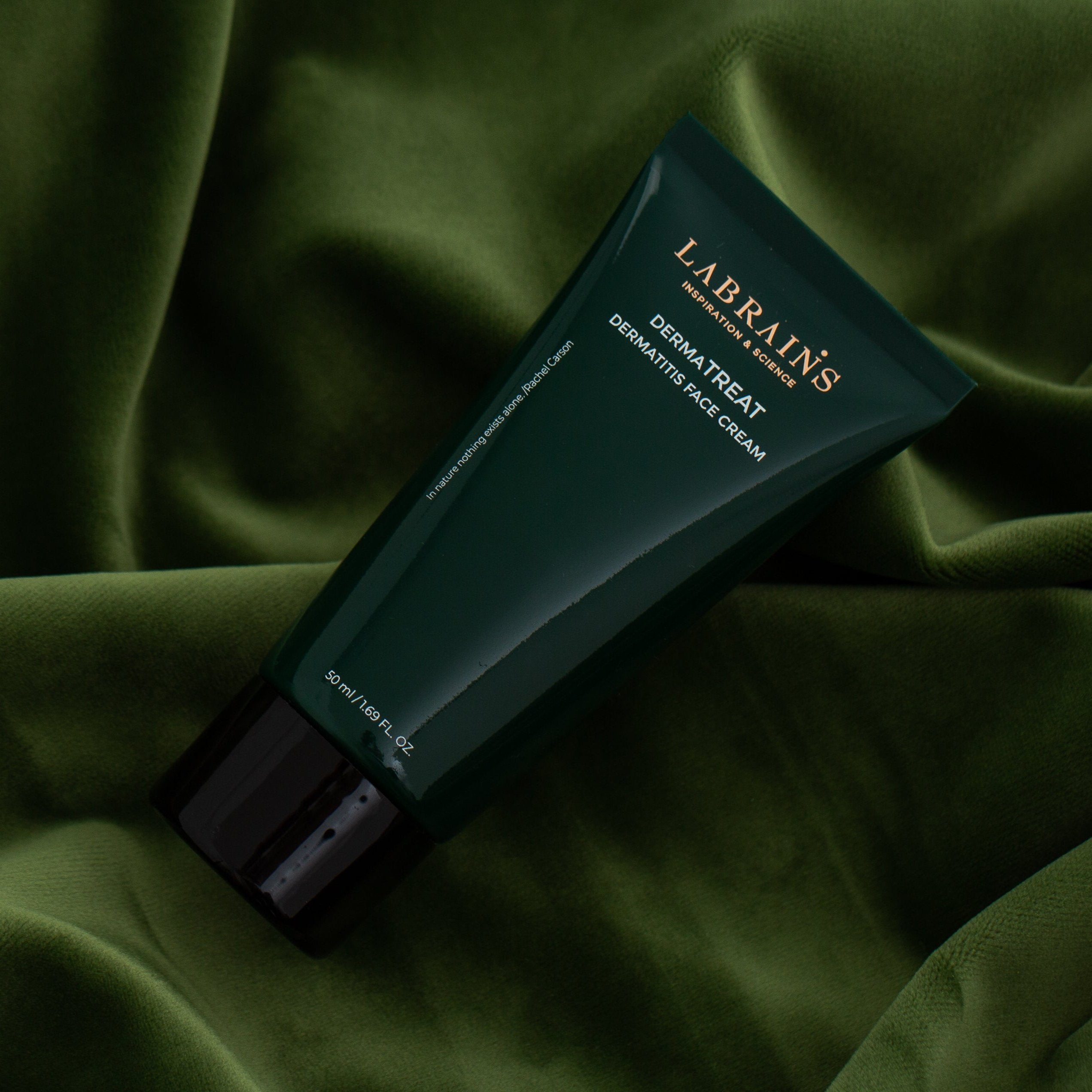 labrains dermatreat cream on green fabric background