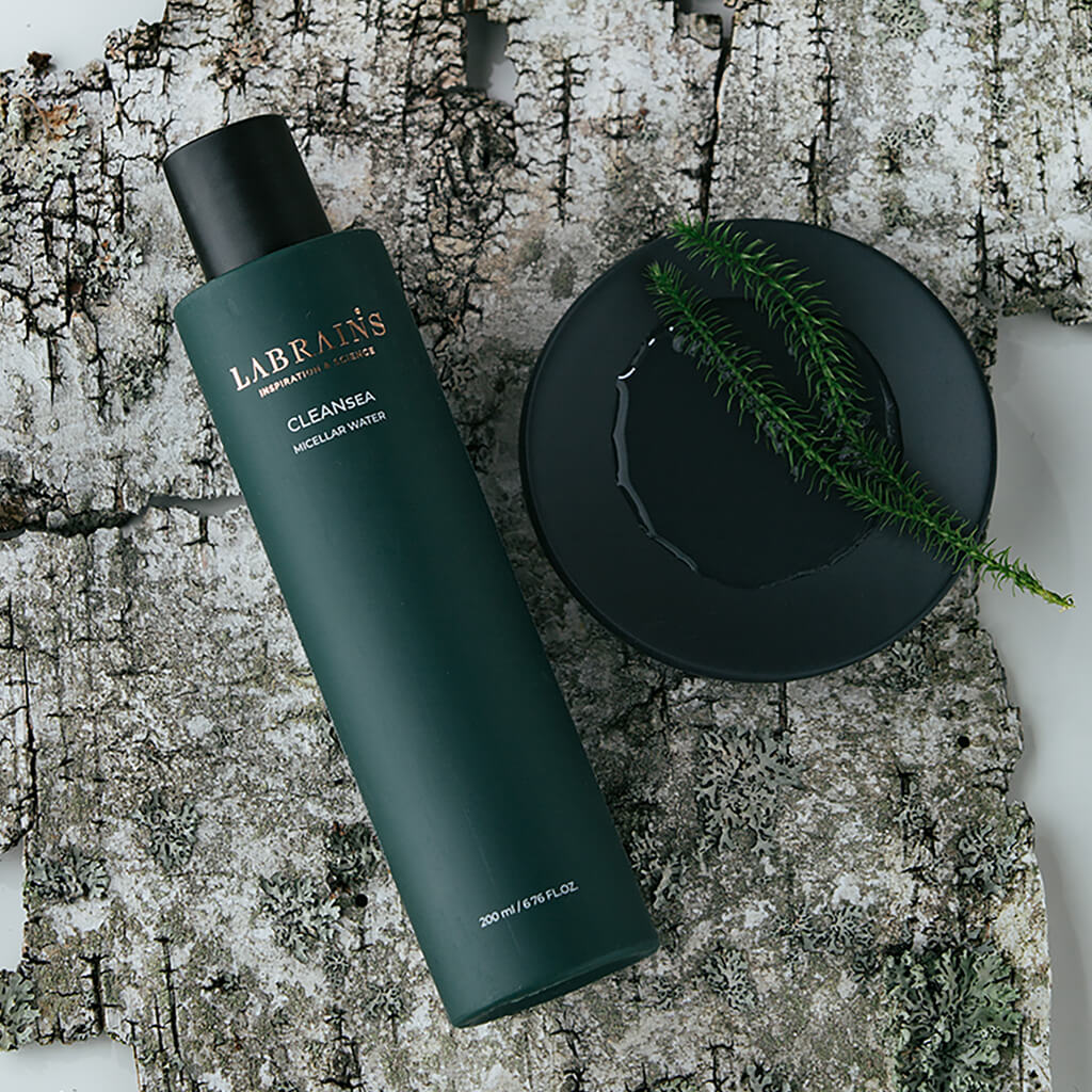 a bottle of labrains micellar water & tonic on a birch bark background