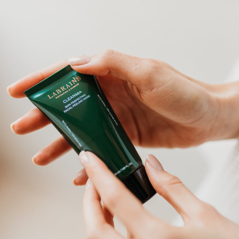 labrains skincare peeling mask tube in hands a neutral background