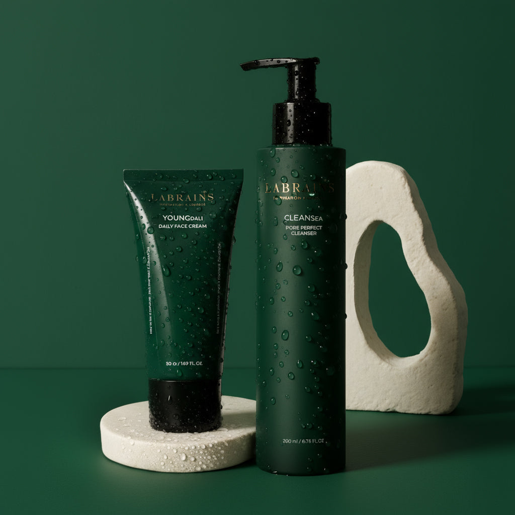 Labrains skincare products, ypoungdali cream and pore perfect cleanser, on a green background