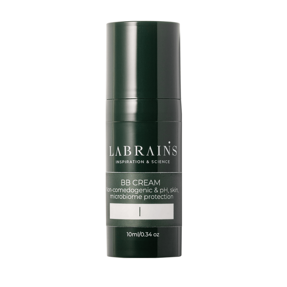 A travel size pump bottle of LABRAINS BB cream ultra light with cold undertones on white background