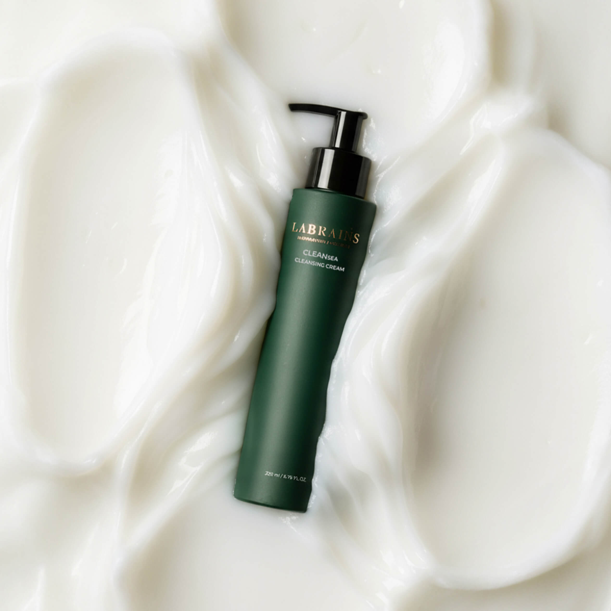 bottle of LABRAINS cleansing cream immersed in white cream 