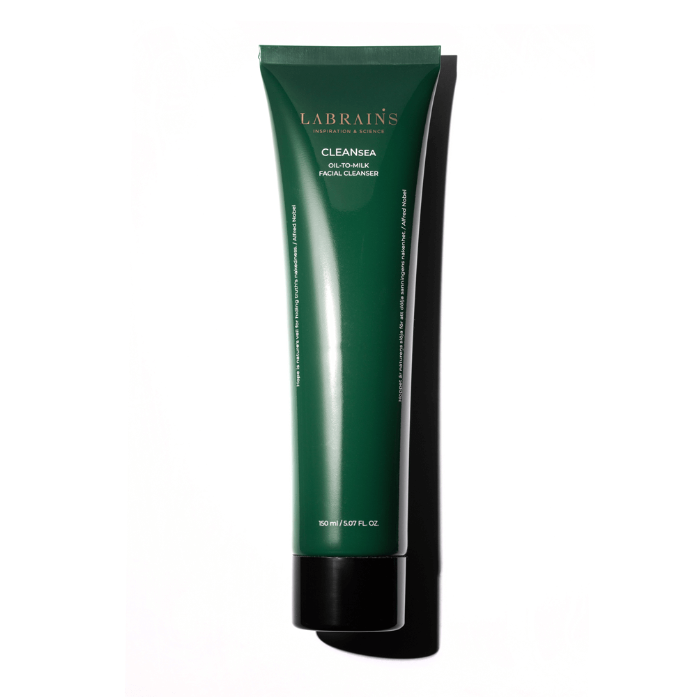 A green tube of OIL-TO-MILK FACE CLEANSER by LABRAINS on white background