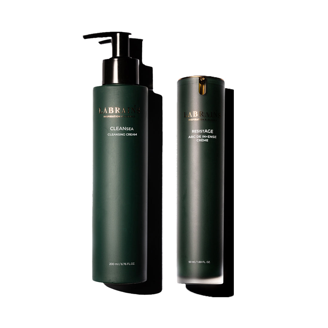 Two dark green LABRAINS skincare bottles, labeled Cleansing cream and ABC de Intense creme, on a white background