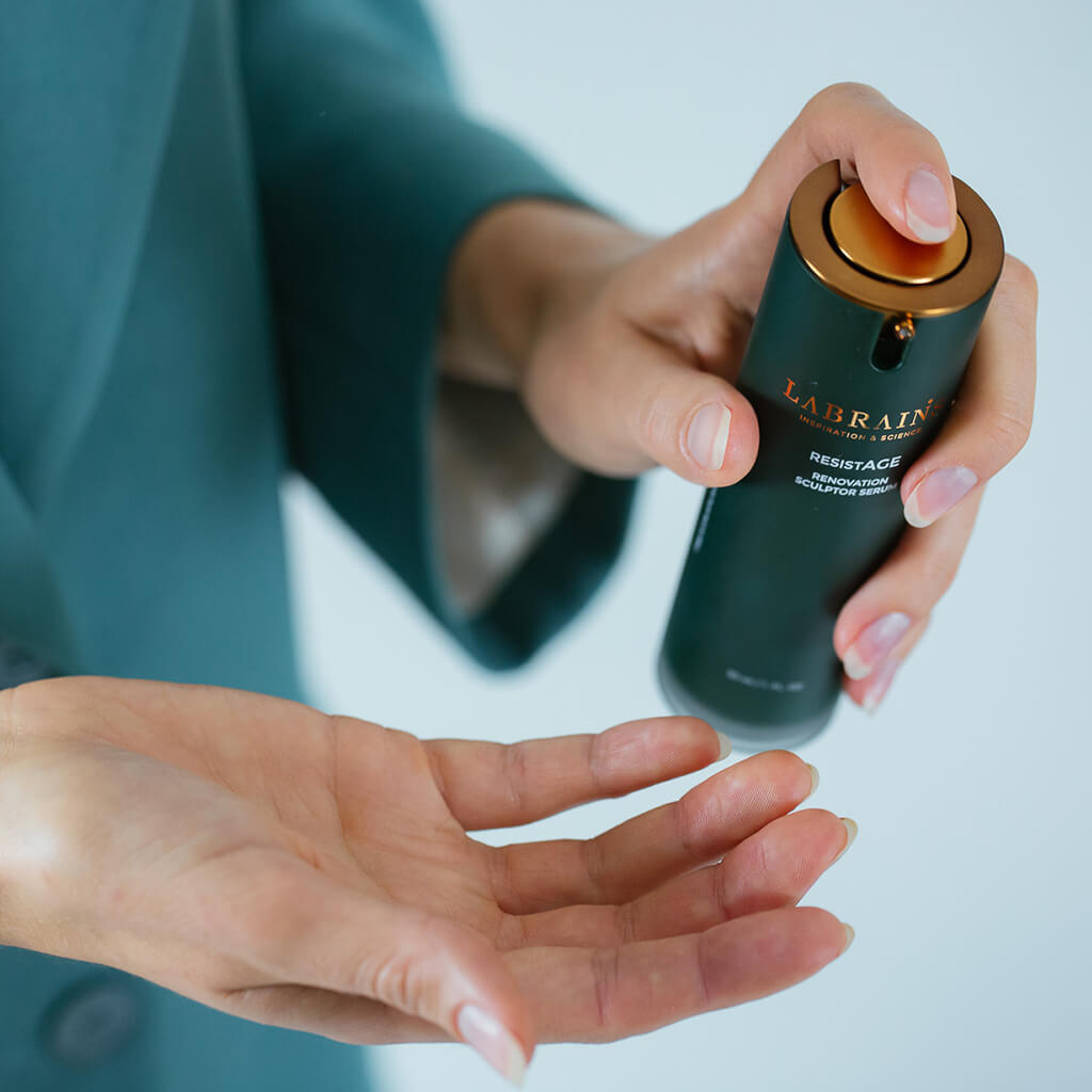womans hands holding labrains renovation sculptor serum